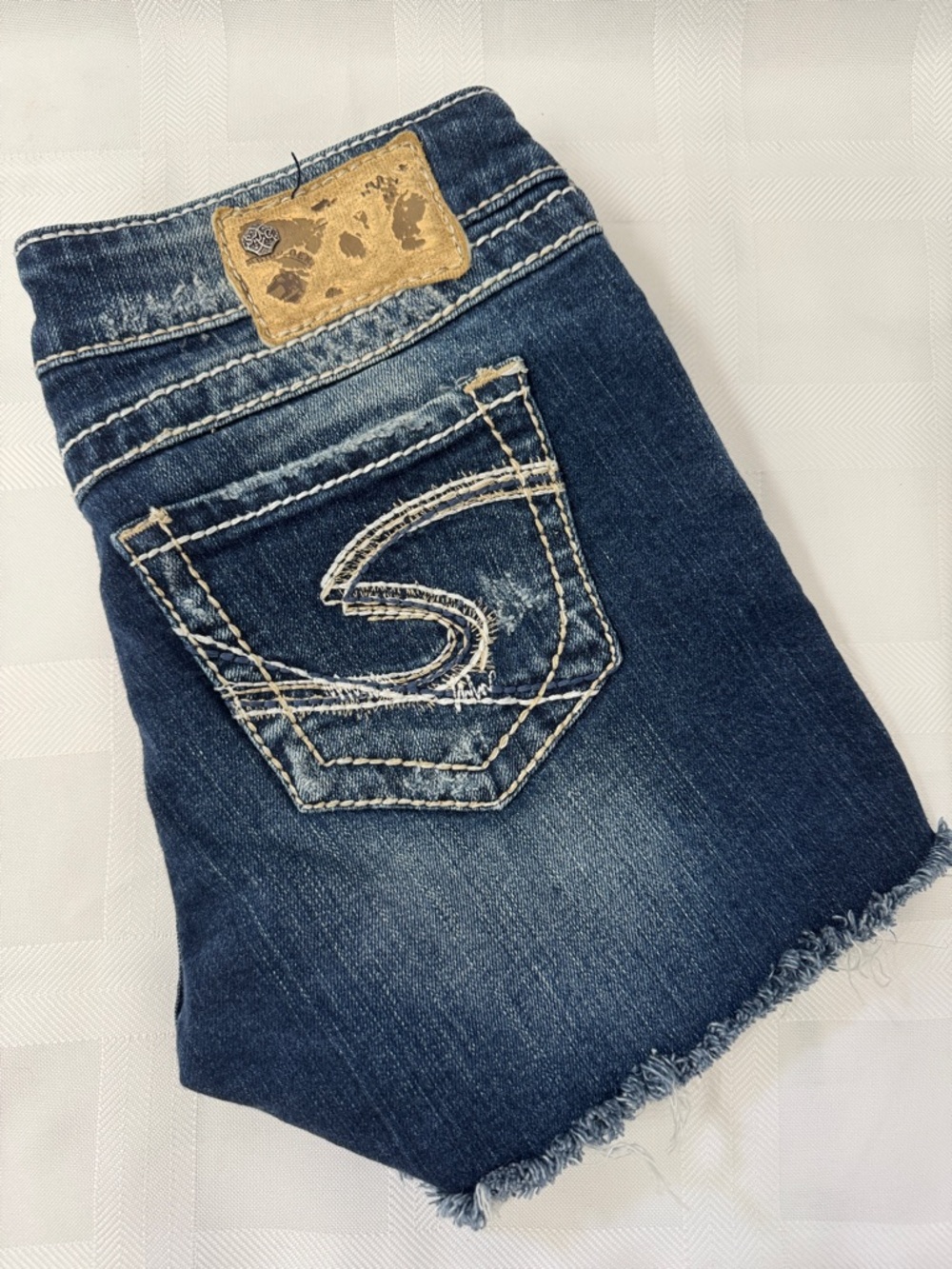 Silver Jeans Low Rise Cut Off Blue Denim Shorts. Distressed.